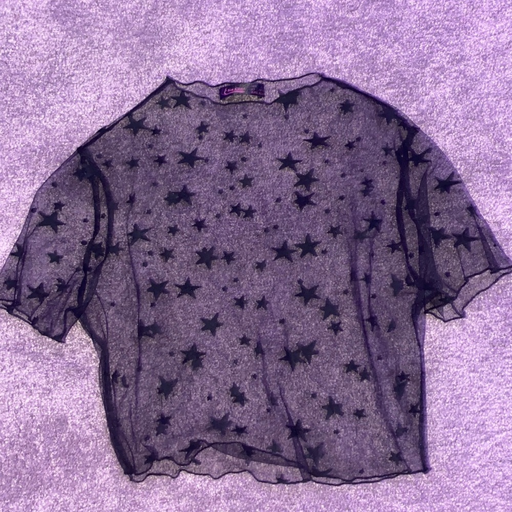 Really cute top by Elia Cher. Black transparent with stars size US 12-14.